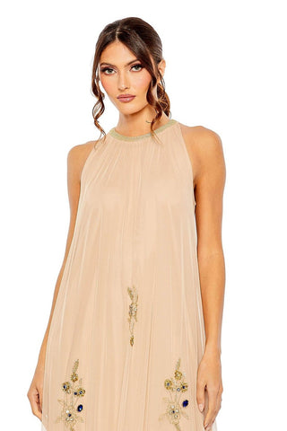 Waist-up view of the champagne gold floral beaded high-neck trapeze gown showing the high halter neckline and beaded floral motifs by Mac Duggal at Mrs. G