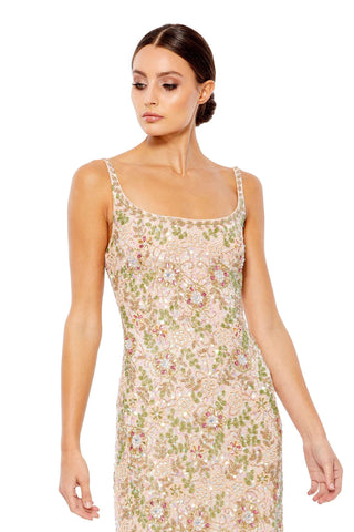 Waist-up view of the beige multi hand-beaded floral scoop neck sleeveless maxi dress showing the scoop neckline, slim straps and beaded flowers by Mac Duggal at Mrs. G
