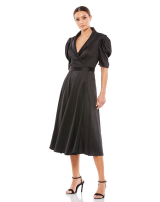 Full-length front view of the black satin faux wrap midi dress with a shawl lapel and puff sleeves by Mac Duggal at Mrs. G