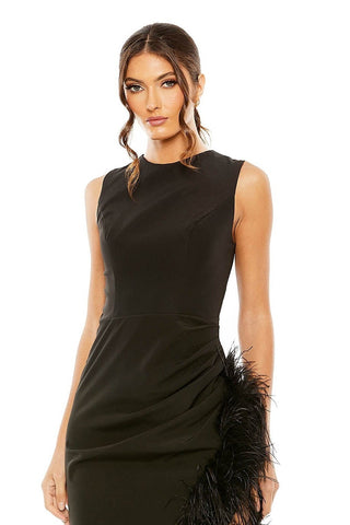 Waist-up view of the black sleeveless high neck asymmetrical feather slit midi dress showing the high neckline and feather trim at the hip by Mac Duggal at Mrs. G
