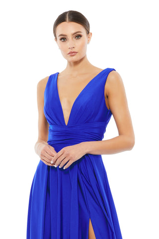 Waist-up view of the royal jersey plunge neck gown showing the deep plunge neckline and gathered waistband by Mac Duggal at Mrs. G