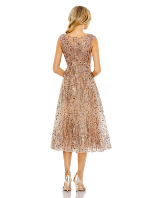 Back view of the bronze fit and flare midi dress with sequin sprays through the skirt by Mac Duggal at Mrs. G