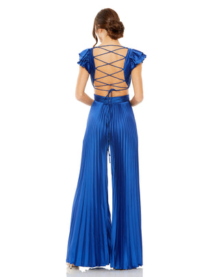 Back view of the cobalt jumpsuit showing the open lace-up back and floor-length pleated legs by Mac Duggal at Mrs. G