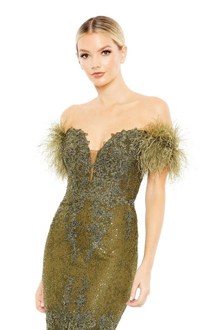 Waist-up view of the olive feathered crystal embellished off-shoulder gown showing the lace sweetheart neckline and feathered sleeves by Mac Duggal at Mrs. G