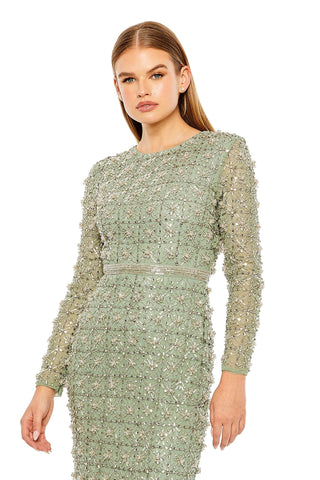 Waist-up view of the jade long-sleeve high-neck beaded gown showing the high neckline, sheer long sleeves and beaded star pattern by Mac Duggal at Mrs. G