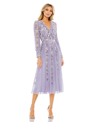 Full-length front view of the lilac embroidered midi dress with a crossover V-neck and sheer long sleeves by Mac Duggal at Mrs. G