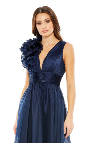 Waist-up view of the midnight sleeveless chiffon A line tea length dress showing the ruffled shoulder rosette and deep V neckline by Mac Duggal at Mrs. G