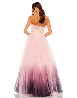 Back view of the pink ombre ball gown with a feather edged strapless back and tulle skirt fading to plum by Mac Duggal at Mrs. G