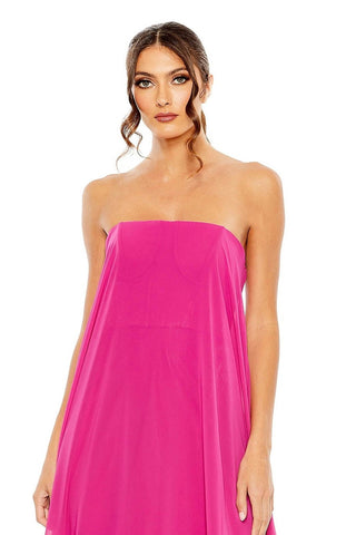 Waist-up view of the fuchsia strapless chiffon feather-hem gown showing the straight strapless neckline and smooth bodice by Mac Duggal at Mrs. G