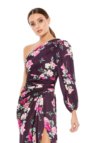 Waist-up view of the plum floral one sleeve gown showing the one shoulder neckline and ruched waist by Mac Duggal at Mrs. G