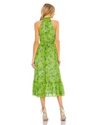 Back view of the sage multi halter dress showing the waist tie and tiered ruffle hem by Mac Duggal at Mrs. G