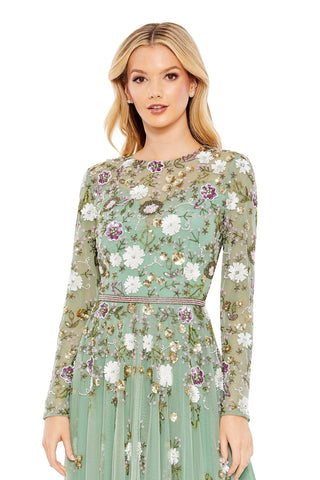 Waist-up view of the sage multi sequin floral long sleeve midi dress showing the beaded flowers on the sheer high neck bodice by Mac Duggal at Mrs. G