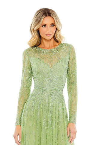 Waist-up view of the sage sequin beaded illusion neck long sleeve A-line gown showing the sheer illusion neckline and beaded long sleeves by Mac Duggal at Mrs. G