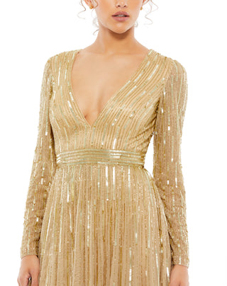 Zoomed-in close-up of the vertical sequin and bead rows, plunging bodice and banded waist in taupe by Mac Duggal at Mrs. G