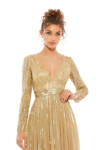 Waist-up view of the taupe sequined plunge neck long sleeve A-line gown showing the plunging V-neckline and vertical sequin rows by Mac Duggal at Mrs. G