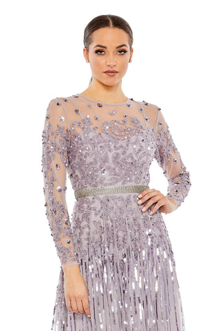Waist-up view of the vintage lilac embellished long sleeve tea length dress showing the beaded scrolls and rhinestone waist band by Mac Duggal at Mrs. G