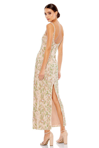 Back view of the beaded floral dress showing the low scoop back and slit by Mac Duggal at Mrs. G