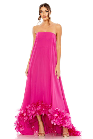 Full-length front view of the pink strapless gown with a feather ruffle on the high-low hem by Mac Duggal at Mrs. G