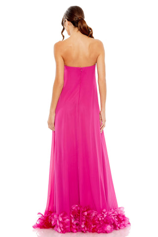 Back view of the pink strapless gown showing the back zipper and feather trim at the hem by Mac Duggal at Mrs. G