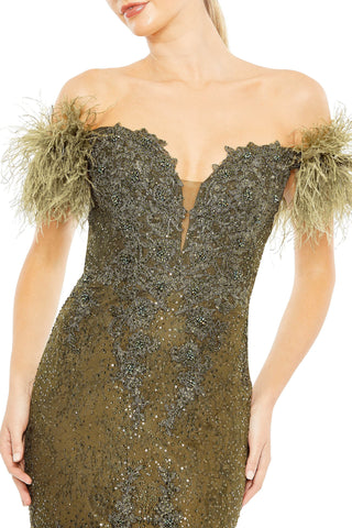 Close-up of the sweetheart neckline, lace applique and feathered off-shoulder sleeves by Mac Duggal at Mrs. G