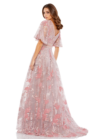 Back view of the pink embroidered A-line gown showing the V-back and sweep train by Mac Duggal at Mrs. G