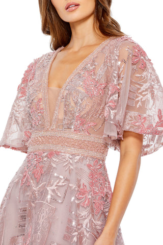 Waist-up close-up of the beaded V-neckline, flounce sleeve and beaded waist band by Mac Duggal at Mrs. G