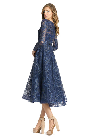 Three-quarter back view of the midnight midi dress showing the sheer sleeves and full A-line skirt by Mac Duggal at Mrs. G
