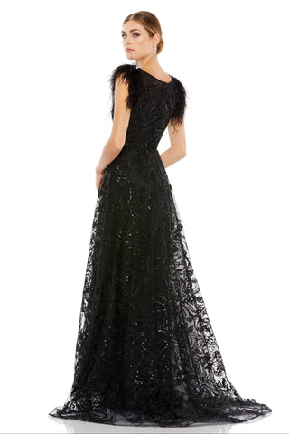 Back view of the black beaded gown showing the feather sleeves and sweeping A-line skirt by Mac Duggal at Mrs. G