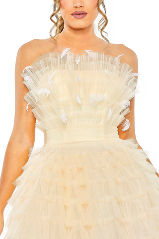Close-up of the ruffled tulle bustier with white feather accents and gathered waistband in ivory by Mac Duggal at Mrs. G