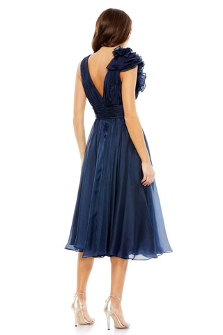 Back view of the midnight tea length dress showing the V-shaped back and A-line skirt by Mac Duggal at Mrs. G