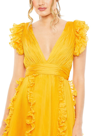Zoomed-in close-up of the ruffled cap sleeves, deep V-neck and vertical skirt ruffles on the marigold gown by Mac Duggal at Mrs. G