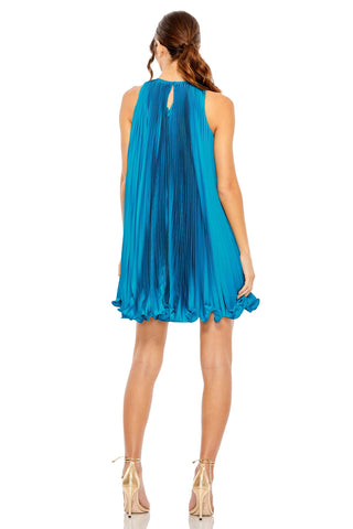 Back view of the ocean blue pleated mini trapeze dress showing the keyhole neck and ruffled hem by Mac Duggal at Mrs. G