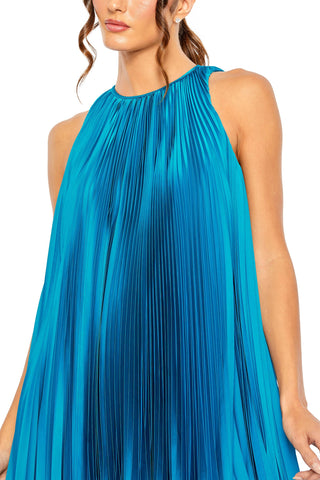 Close-up of the halter neckline and fine pleating on the ocean blue mini dress by Mac Duggal at Mrs. G