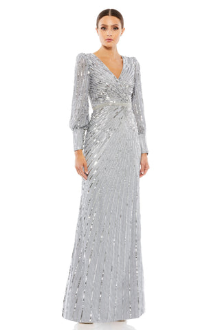 Full-length front view of the silver sequin wrap gown with V-neck and bishop sleeves by Mac Duggal at Mrs. G