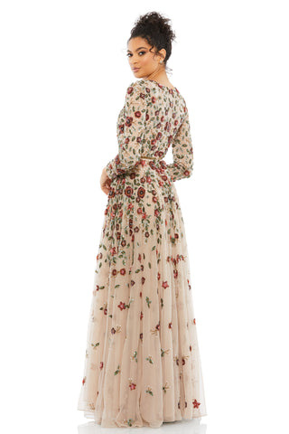 Three-quarter back view of the floral applique gown with long sleeves and tulle skirt by Mac Duggal at Mrs. G