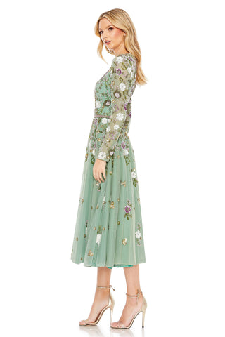 Side view of the sage multi midi dress showing the full mesh skirt and sheer sleeve by Mac Duggal at Mrs. G