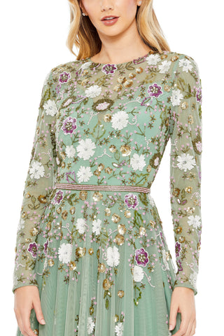 Zoomed-in close-up of white, plum and gold beaded flowers on the high-neck bodice and sleeves by Mac Duggal at Mrs. G