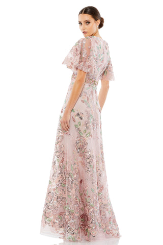 Back view of the rose pink embroidered gown showing the sleeve layers and sequin leaves on the skirt by Mac Duggal at Mrs. G