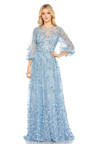 Full-length front view of the blue A-line gown with a sheer illusion neckline and leaf embroidery by Mac Duggal at Mrs. G