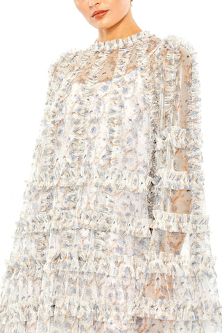 Close-up of the ruffle-trimmed neckline and pale blue floral mesh on the white mini dress by Mac Duggal at Mrs. G