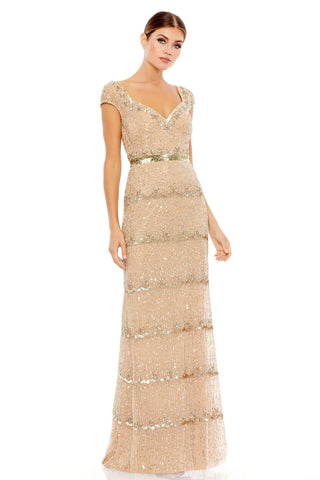 Full-length front view of the champagne beaded cap-sleeve column gown with sweetheart neckline and gold belt by Mac Duggal at Mrs. G