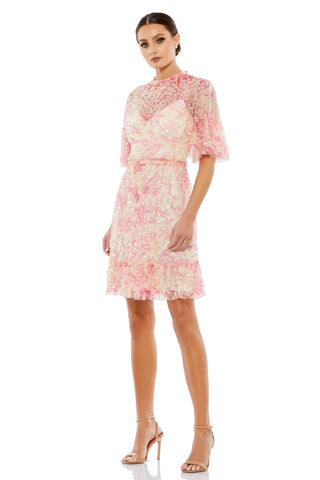 Front view of the pink floral sequin dress with illusion neckline and flounce sleeves by Mac Duggal at Mrs. G