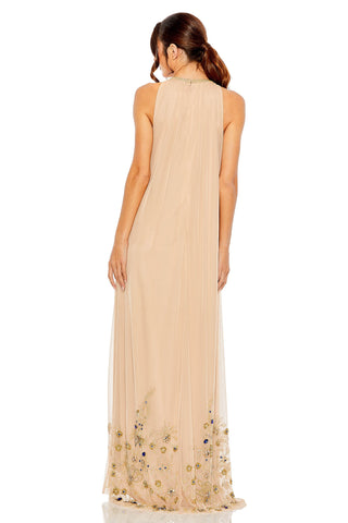 Back view of the beige trapeze gown showing the sleeveless cut, neck zipper and beaded hem by Mac Duggal at Mrs. G