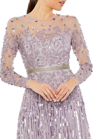Waist-up close-up of the beaded scrolls, illusion neckline and rhinestone waist band in vintage lilac by Mac Duggal at Mrs. G