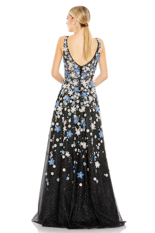 Back view of the black floral gown showing the deep V back and flowers scattered down the skirt by Mac Duggal at Mrs. G