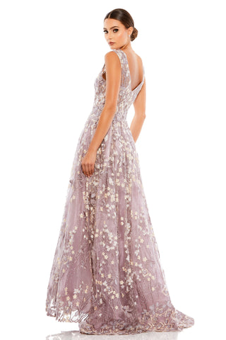 Back view of the lilac floral gown showing the scooped back and embroidered A-line skirt by Mac Duggal at Mrs. G