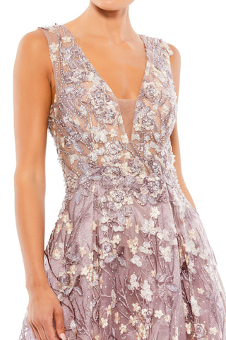 Waist-up close-up of the sheer V-neck bodice with cream and lavender embroidered flowers by Mac Duggal at Mrs. G