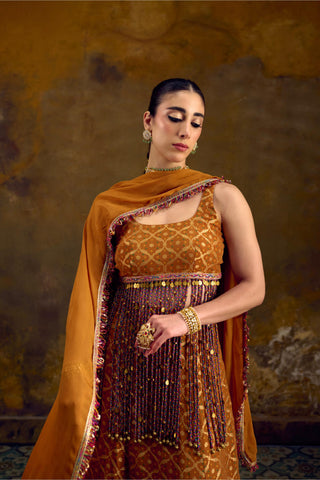 Yellow Banarasi Bandhani Lehenga Set with Cascading Tassels by Muskkaan Kapadia
