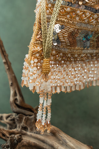 Gold imperial medley potli, close-up detail, by Nayaab by Sonia at Mrs. G