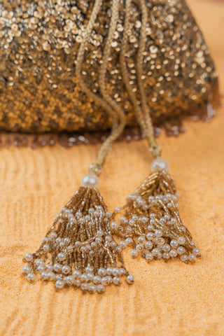 Gold shimmer viel antique potli, close-up detail, by Nayaab by Sonia at Mrs. G